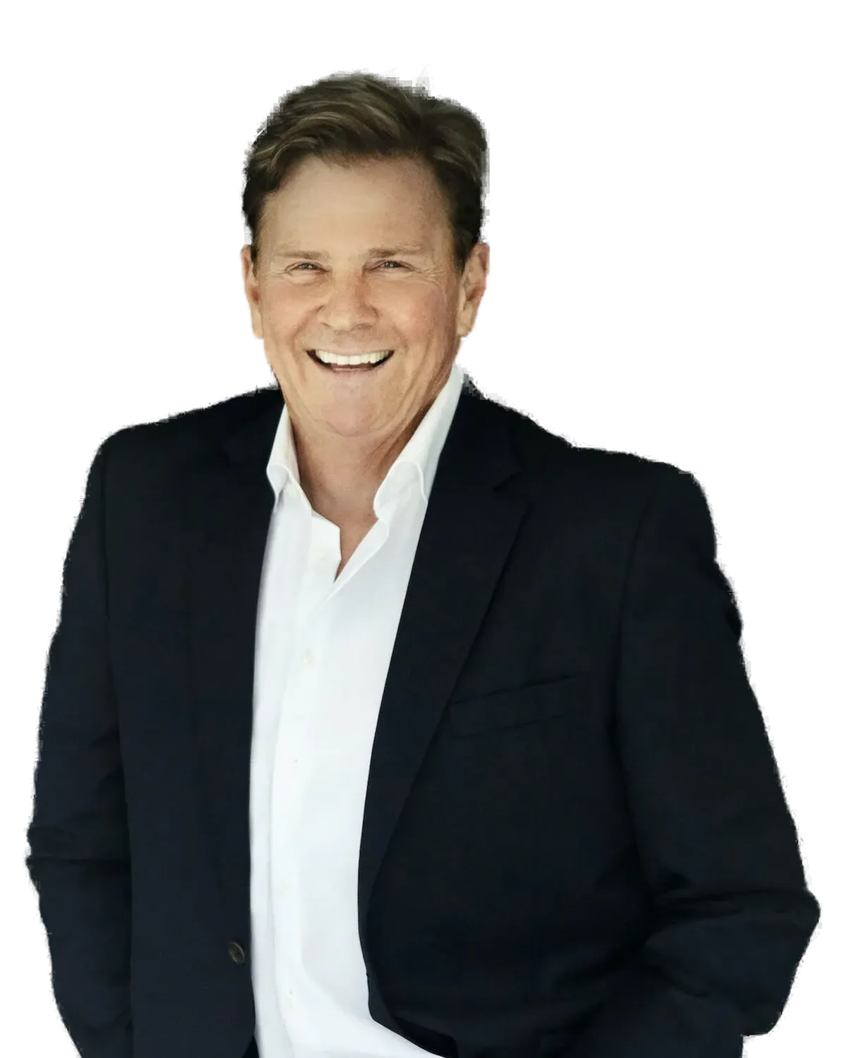 Jeff Lavender smiling in a dark blazer and open white shirt.